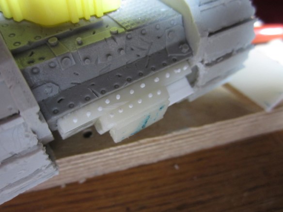 The roller at the front was too close. So I built it out a bit. More rivets!